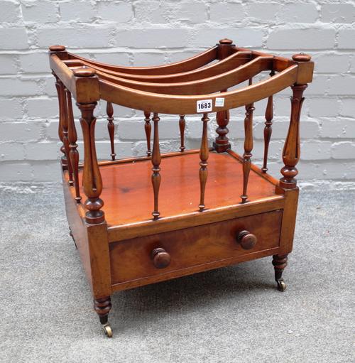 A William IV mahogany Canterbury, the concave three division top over single drawer on turned supports, 48cm wide x 57cm high x 38cm high.