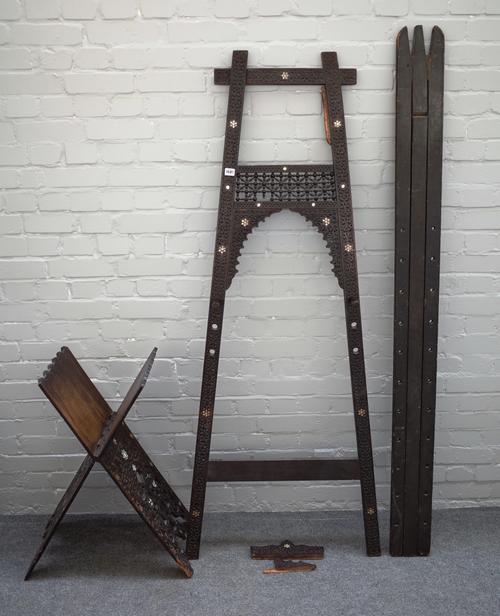 An early 20th century North African mother-of-pearl inlaid carved hardwood and bobbin turned 'A' frame artist's easel, 71cm wide x 174cm high, togethe
