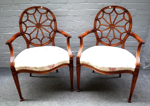 A pair of 20th century "spider web" back open armchairs on tapering square supports, 60cm wide x 95cm high (2).