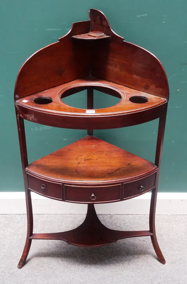 A Regency mahogany bowfront corner washstand, on splayed supports, 61cm wide x 114cm high.