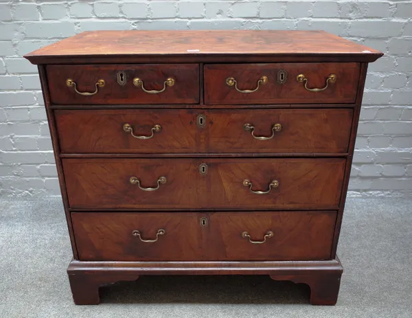 A George III and later figured walnut chest with two short and three long graduated drawers on bracket feet, 93cm wide x 87cm high x 58cm deep.