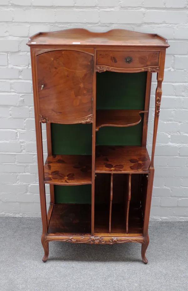 Nancy School; a late 19th century floral carved and marquetry inlaid mahogany music cabinet, with single drawer and cupboard above multiple open tiers