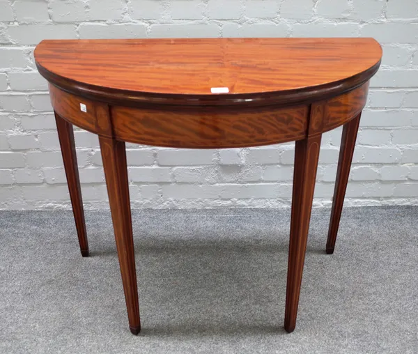 A George III inlaid mahogany semi-elliptic tea table on tapering square supports, 92cm wide x 75cm high x 46cm deep.