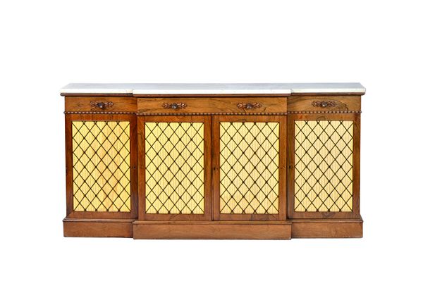 A William IV breakfront side cabinet, the marble top over three frieze drawers and four brass grille cupboards on plinth base, 183cm wide x 91cm high
