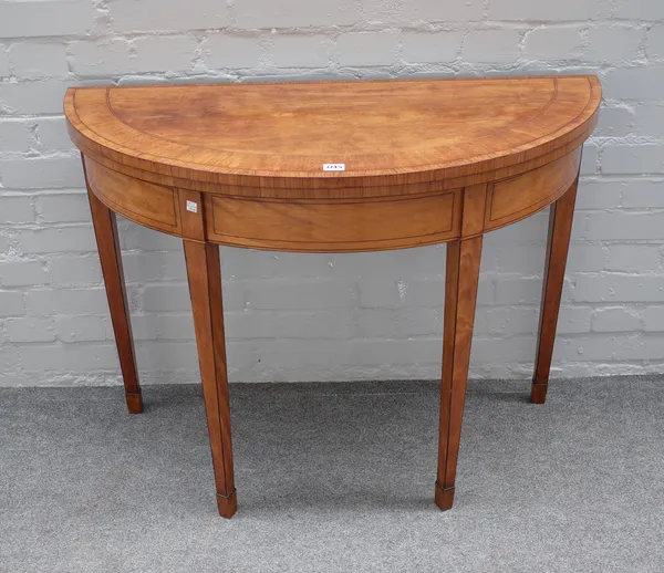 A George III mahogany banded satinwood semi-elliptic card table, on tapering square supports, 100cm wide x 74cm high x 45cm deep.