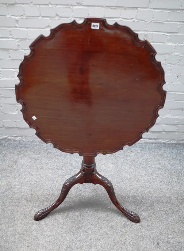 An 18th century mahogany occasional table, the pie crust snap top on carved tripod base, 71cm wide x 72cm high.