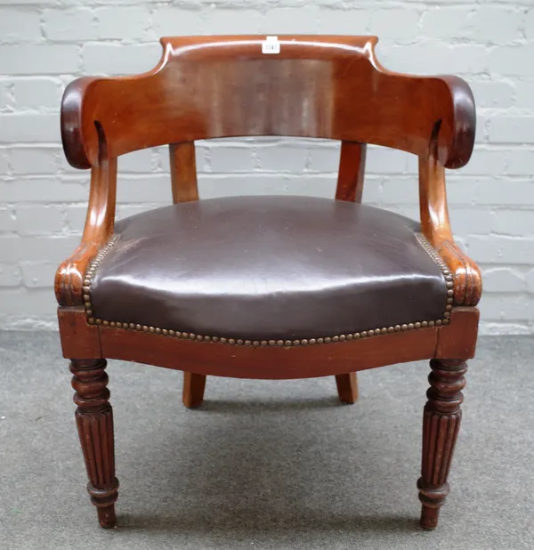 A late 19th century mahogany framed tub back office chair with studded brown leather upholstered serpentine seat on reeded supports, 60cm wide x 76cm