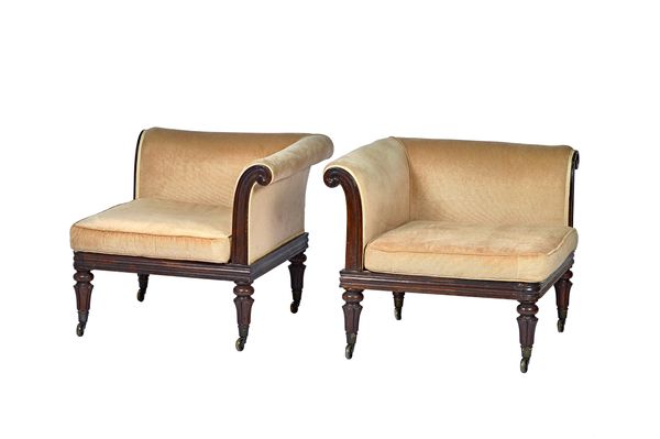 A pair of George IV and later rosewood corner chairs, each with rollover arms on flared reeded supports, 77cm wide x 67cm high (2). Illustrated