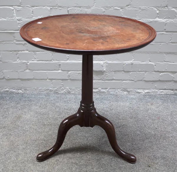A mid-18th century mahogany occasional table, the dished circular one piece top on a tripod base, 55cm diameter x 68cm high.
