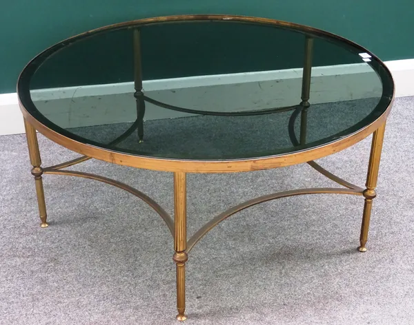 A mid-20th century lacquered brass circular coffee table, with smoked glass inset top on reeded supports, 93cm diameter x 42cm high.