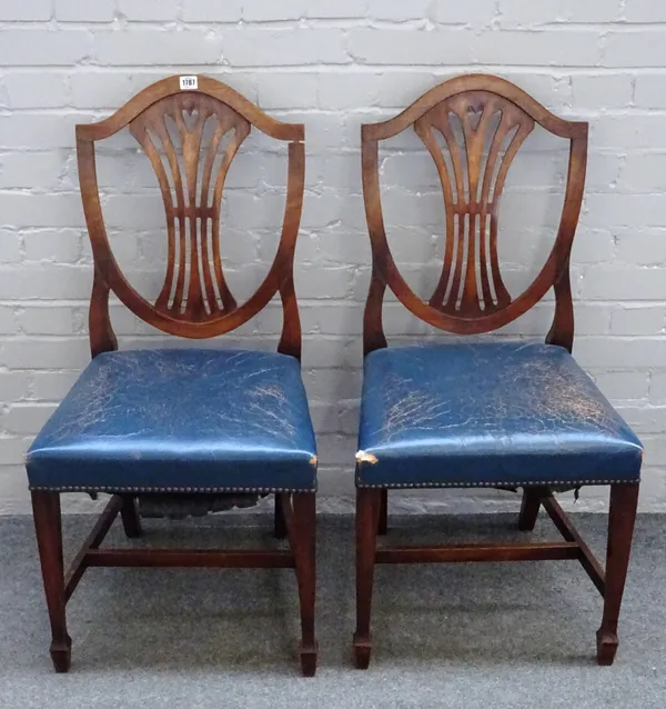 A set of fourteen George III style mahogany shield back dining chairs, on tapering square supports, (14).