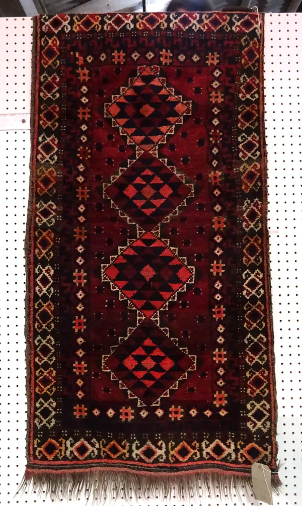 An Afghan rug, 140cm x 71cm.  B8