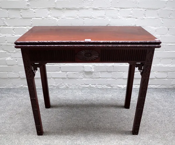 A George III mahogany rectangular mahogany concertina action card table in the Chinese Chippendale manner, with blind fret decoration, 81cm wide x 73c