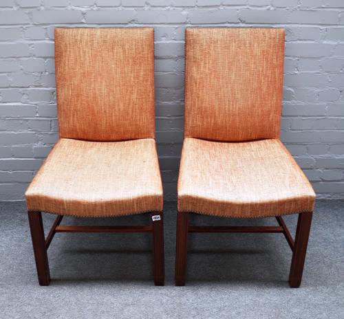 A set of eight George II style mahogany framed square back dining chairs on channelled square supports, 53cm wide x 98cm high.(8).