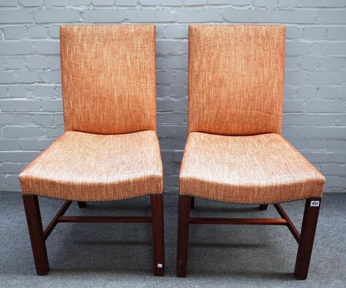 A set of eight George II style mahogany framed square back dining chairs on channelled square supports, 53cm wide x 98cm high.(8).