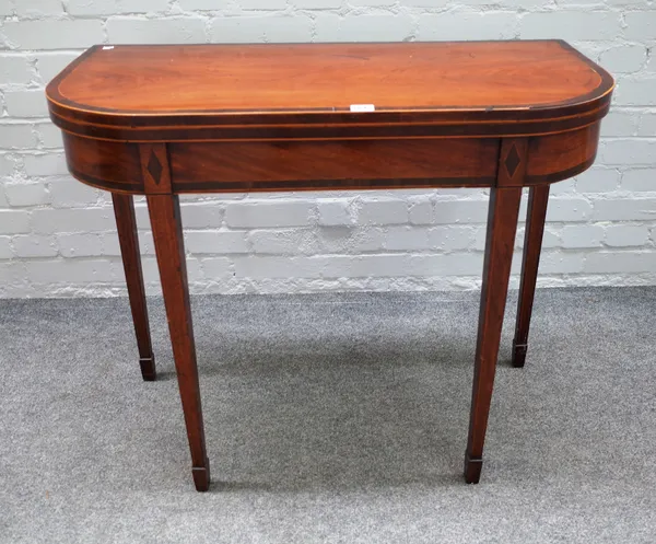 A late George III inlaid mahogany 'D' shaped card table, on tapering square supports, 89cm wide x 73cm high x 44cm deep.