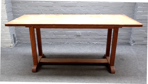 In the manner of Gordon Russell, a mid-20th century oak refectory table, on four block supports, united by slab stretcher, 68cm wide x 74cm high x 168