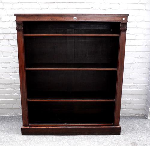 A William IV and later rosewood and mahogany floor standing open four tier bookcase, on plinth base, 123cm wide x 144cm high x 39cm deep.