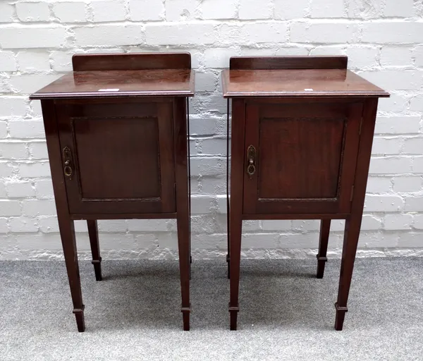 Waring & Gillow. Ltd; a pair of mahogany single door bedside tables, on tapering square supports, 41cm wide x 76cm high (2).