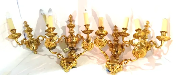 Three pairs of 20th century brass two branch wall lights with cherub finials, 37cm wide x 33cm high, (6).  S2B