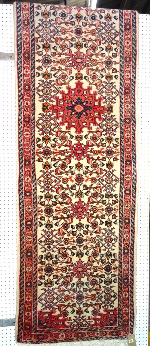 A Hosseinabad runner, 316 x 82cm.   BAY 1