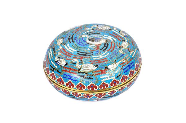 A Chinese cloisonné circular box and cover, 19th century, each worked with cranes against a turquoise ground inside ruyi-head borders, the interiors s