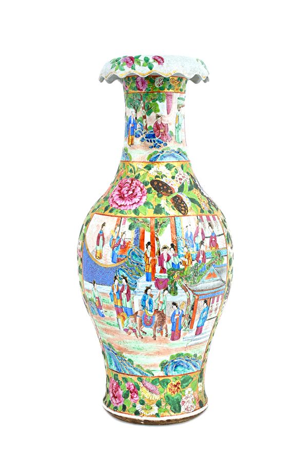 A tall Canton famille-rose vase, 19th century, of slender baluster form with overturned rim, painted with figurative panels against a solid gilt groun