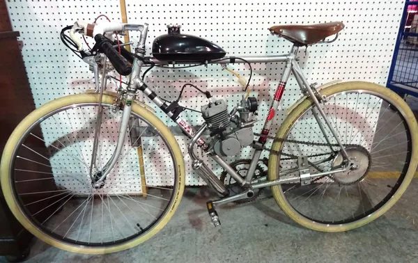 A 20th century Dawes bicycle fitted with a 2 stroke petrol engine, approximately 49cm  H5.