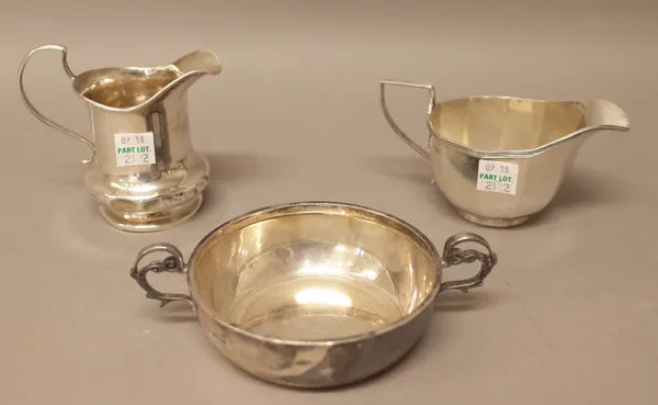 Silver, comprising; a twin handled circular bowl, Sheffield 1961, a cream jug, Birmingham 1924 and a milk jug, Birmingham 1911, combined weight 349 gm