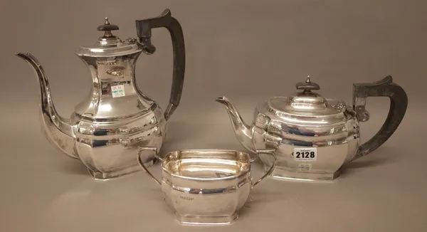A silver three piece part tea set, comprising; a teapot, a hot water jug/coffee pot and a twin handled sugar bowl, each piece of curved panelled form,