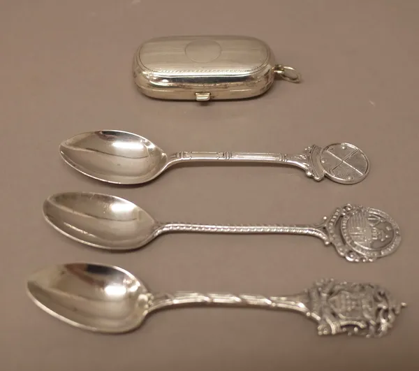 A silver twin compartment sovereign case, decorated with engine turned bands, Birmingham 1911 and 1910 and three silver spoons, including two souvenir
