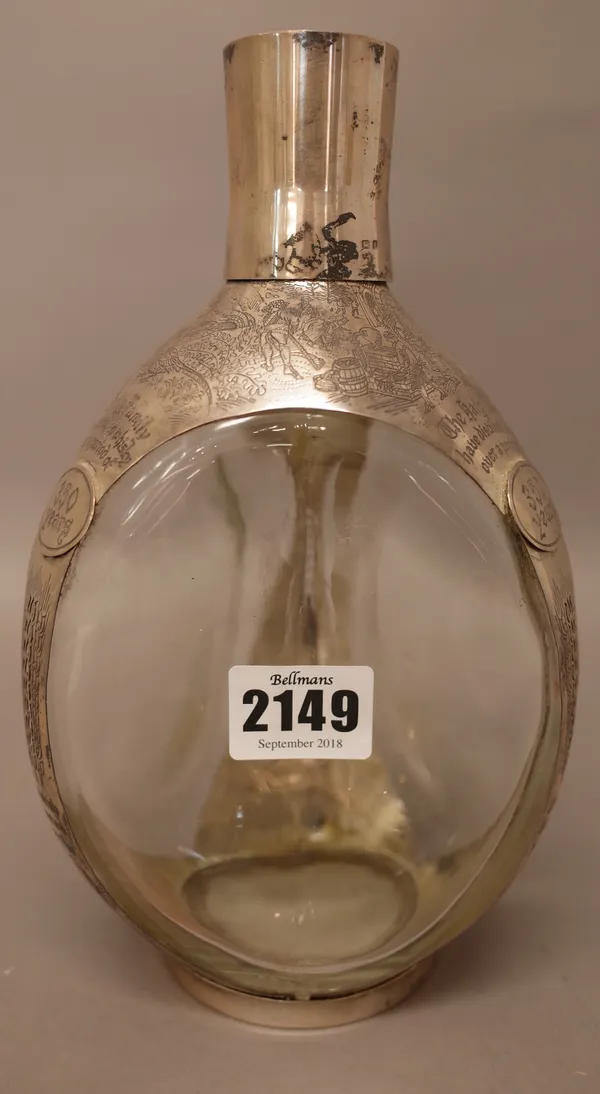 A silver mounted Haig whisky bottle, with engraved decoration, detailed The Haig family have distilled whisky over a period of 350 years and also, Thi
