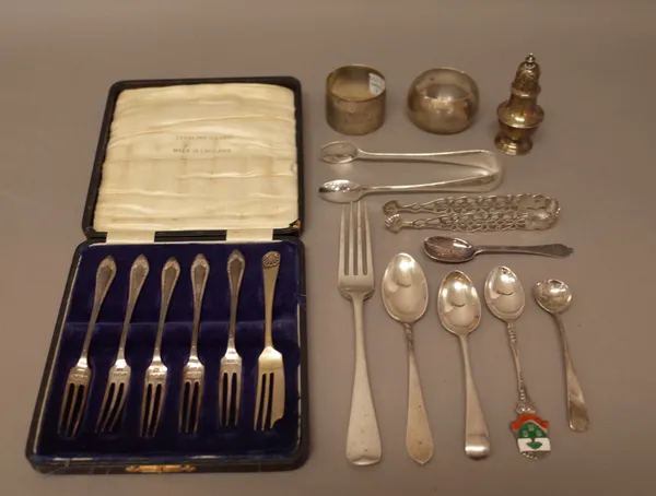 Silver, comprising; five pastry forks, with a case, two napkin rings, two pairs of sugar tongs, a pepperette, a fork and five various spoons, also a b