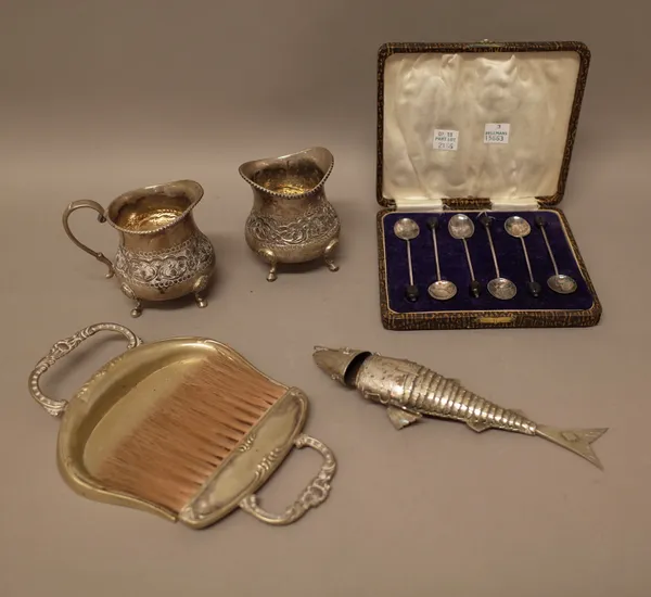 A set of six silver coffee spoons, having black bean finials to the handles, Birmingham 1924, with a case and foreign wares, comprising; a milk jug, w
