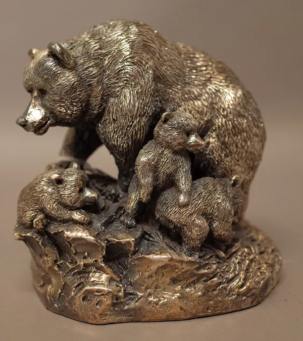 A loaded silver model of a bear with three cubs, in a rocky setting, height 12cm, and an Italian silvered seashell, detailed Argenterie Made In Italy,