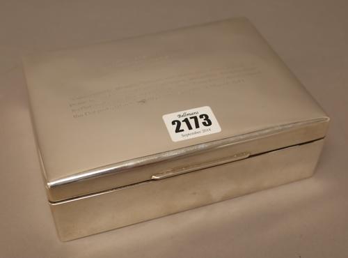 A silver rectangular hinge lidded table cigarette box, wooden lined within, the lid presentation inscribed, size 18cm x 13cm, detailed Birks Sterling.