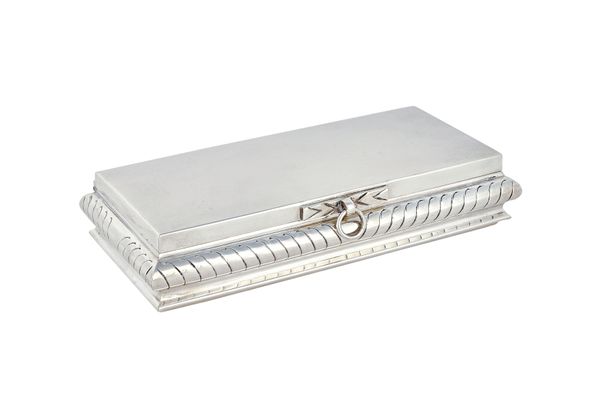 A foreign rectangular hinge lidded table cigar box, wooden lined within, presentation inscribed within the lid, the bombe sides with slanting decorati