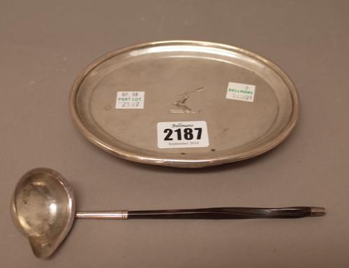 A George III silver mounted oval teapot stand, crest engraved and with a wooden base, London 1806, length 15cm and a silver small toddy ladle, with a
