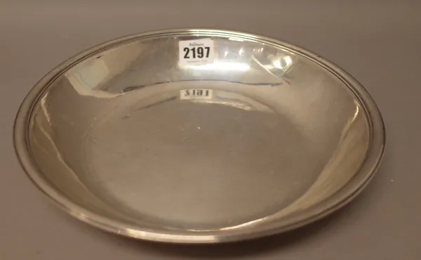 A French shallow bowl, of circular form, with a reeded rim, the underside initial engraved, diameter 25cm, weight 488 gms.
