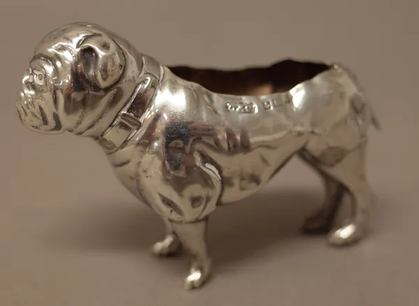 A silver pin cushion frame, modelled as a standing dog, (the upholstery lacking), Birmingham possibly 1905, gross weight 20 gms.