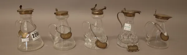 A collection of five silver mounted glass whisky noggins, in a variety of designs, with five whisky noggin labels as fitted, various dates, (5).