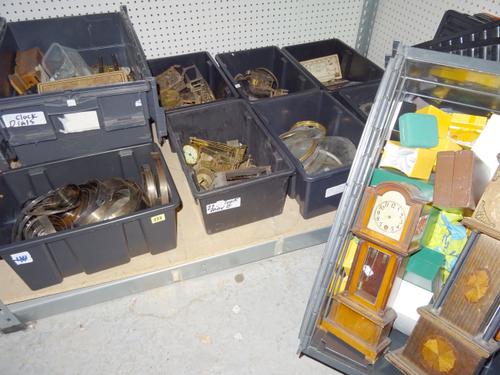 A quantity of clock movements, electric movements, a quantity of clock glasses and bezels, a box of mainsprings, two 'miniature' long clock mantel clo