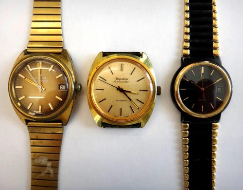 A Bulova Ambassador Automatic gilt metal fronted and steel backed gentleman's wristwatch, the signed dial with black baton numerals and with centre se