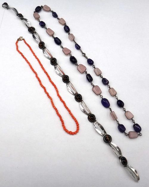 A Danish silver and tiger's eye collar necklace, in a curved and pierced link design, on a hook shaped clasp, detailed N .E. FROM 925 S STERLING DENMA