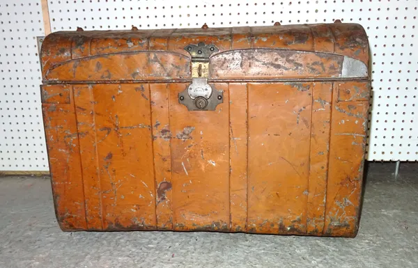 An early 20th century metal dome top trunk with faux wood decoration, 65cm wide x 48cm high.  E4
