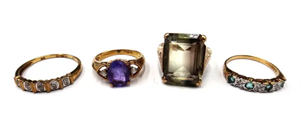 A 9ct gold, emerald and diamond set seven stone half hoop ring, a 9ct gold ring, claw set with an oval cut amethyst between two small circular cut dia
