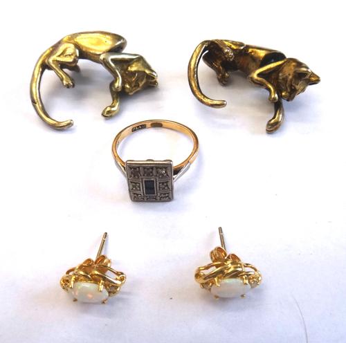 A pair of opal and diamond three stone earstuds, each claw set with a central oval opal, between two small circular cut diamonds, the backs with post