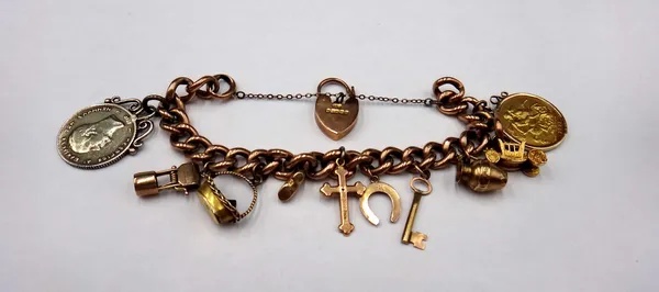 A gold, hollow curb link charm bracelet, detailed 9 C, fitted with ten pendants and charms, including a George V sovereign 1911, a gold plated Greek c