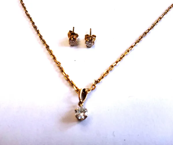 A gold and diamond single stone pendant, claw set with a circular cut diamond, on a 9ct gold oval link neckchain, with a boltring clasp and a pair of
