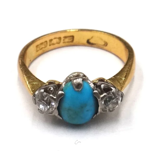 A gold, turquoise and diamond three stone ring, claw set with the oval turquoise, between two cushion shaped diamonds, ring size L.